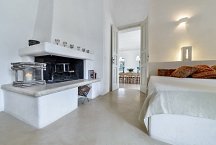Cortile Del Sole_lounge or additional bedroom with fireplace